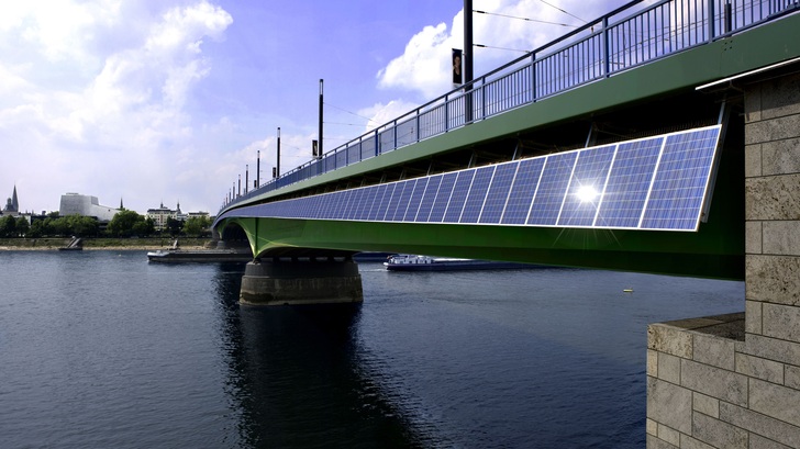 Die Kennedybrücke führt mit 392 Solarstrommodulen über dem Rhein. - © Solarworld
 Die Kennedybrücke führt mit 392 Solarstrommodulen über dem Rhein.